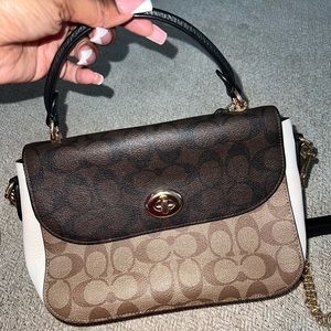 Coach bag. Marlie top handle satchel in blocked signature canvas.